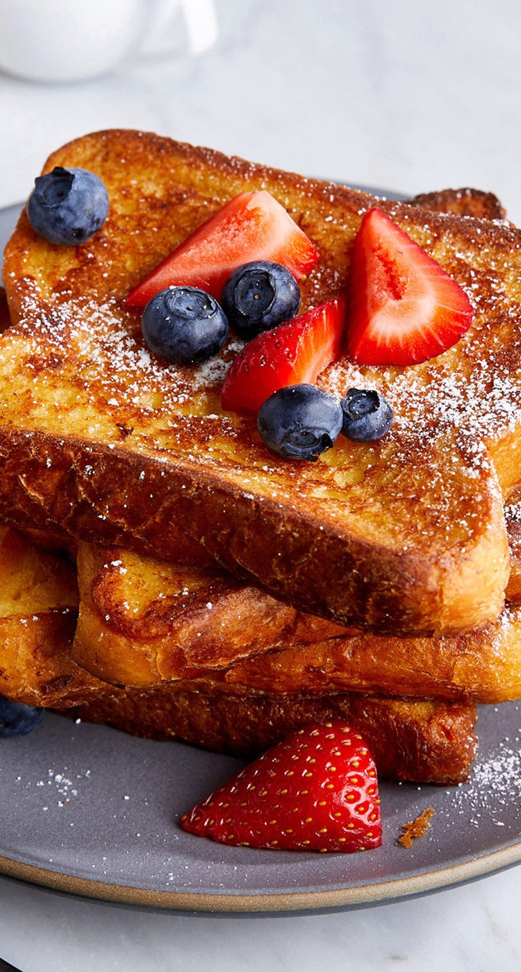 french toast made with JUST Egg topped with strawberries and blueberries