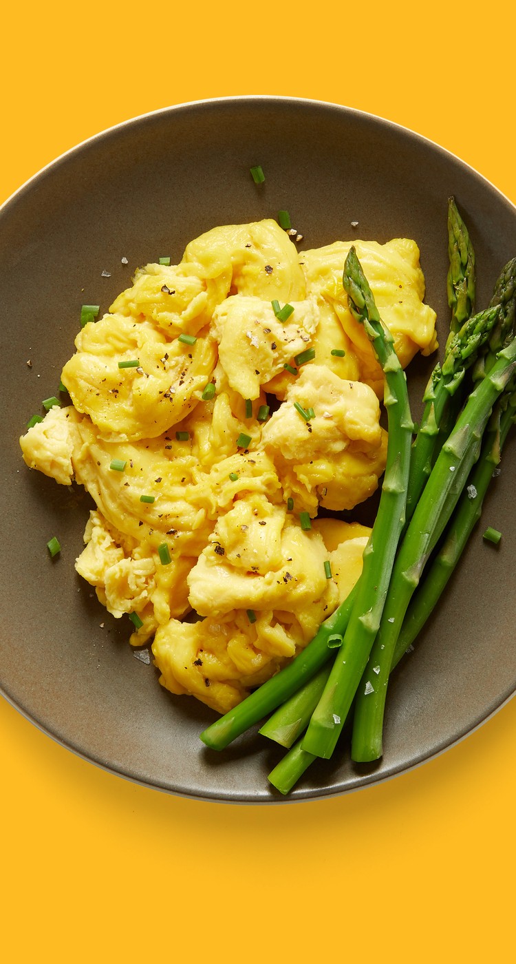 scrambled just egg with asparagus on a plate